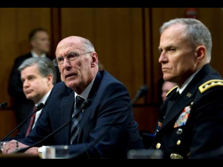 Director of National Intelligence Daniel Coats (left) testifies before the Senate Intelligence Committee on Capitol Hill in Washington on Tuesday, January 29. 