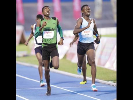 Tyrice Taylor (right) from Enid Bennett High School (Bog Walk) competes with Kevoy Venson of Calabar in the Class Two boys 800m  at the G.C. Foster Classics at the National Stadium on Saturday, March 11, 2018. 