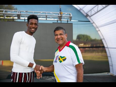 British High Commissioner Asif Ahmad (right) congratulating Kemari Ewen on his win.