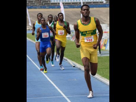 Clayon Cooper (right) of  St Mary High wins the Class One boys’ 800 metres final ahead of his teammate, Joshua Smiley (centre), and Jerome Hinds (left) of  Glengoffe  High on Tuesday’s final day of the 2019  Eastern Athletic Championships at the National Stadium.