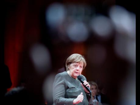 German Chancellor Angela Merkel attends the ‘Global Solutions Summit’ in Berlin, Germany, yesterday. Germany has launched an auction for frequencies in the future super-fast 5G network following a dispute over conditions imposed by authorities and questions over whether China’s Huawei can supply equipment.