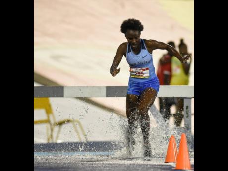 Credit: Gladstone Taylor Aneisha Ingram of Edwin Allen winning the girls’ 2000m Steeplechase open final at the ISSA/GraceKennedy Boys’ and Girls’ Athletics Championships at the National Stadium on Thursday. Ingram won with a time of 7:11.17.