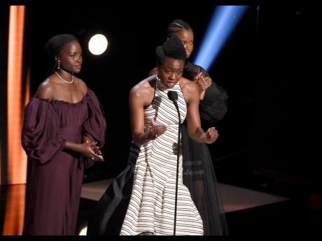 From left: Lupita Nyong’o, Danai Gurira, and Letitia Wright accept the award for Outstanding Motion Picture for ‘Black Panther’ at the 50th annual NAACP Image Awards on Saturday.