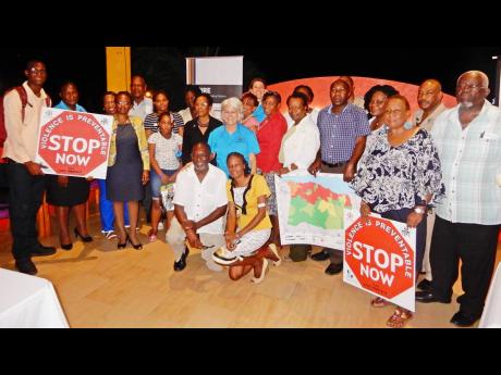 Dr Elizabeth Ward (centre), head of the Violence Prevention Alliance (VPA), along with persons who attended the VPA launch in St Ann.  