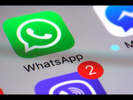 This March 10, 2017 file photo shows the WhatsApp communications app on a smartphone in New York. WhatsApp says a vulnerability in its  app let mobile phones be infected with sophisticated spyware with a missed in-app call alone. 