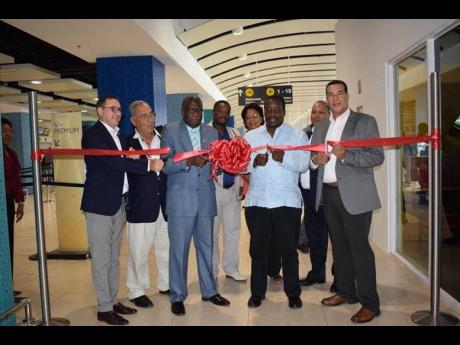 Directors on the Board of the AAJ: Rafael Echevarne (CEO MBJ) William Shagoury, Custos of Clarendon & Chairman AAJ; Honourable Minister of Transport and Mining Robert Montague; His Worship Councillor Homer Davis, Mayor of Montego Bay; Councillor Heroy Clarke; Fay Hutchinson. Audley Deidrick (president & CEO, AAJ) is pictured in the background.