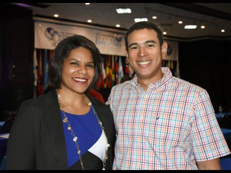 Women in Maritime WiMAC representative Lisa Russell shares a moment with Caribbean Shipping Association President Juan Carlos Croston after her presentation at the 18th annual Caribbean Shipping Executives’ Conference on May 21. 