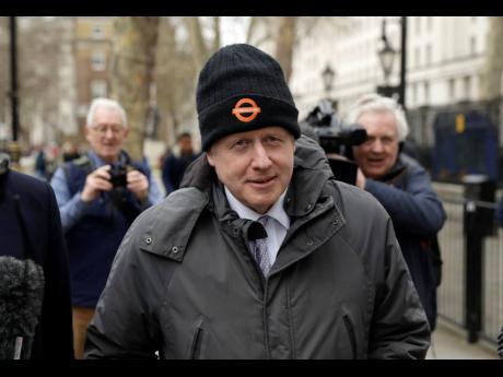 Credit: The Associated Press In this Tuesday, March 19, 2019 file photo, Boris Johnson, Britain’s former foreign secretary and prominent Brexit campaigner, walks away after leaving the Cabinet Office in London.