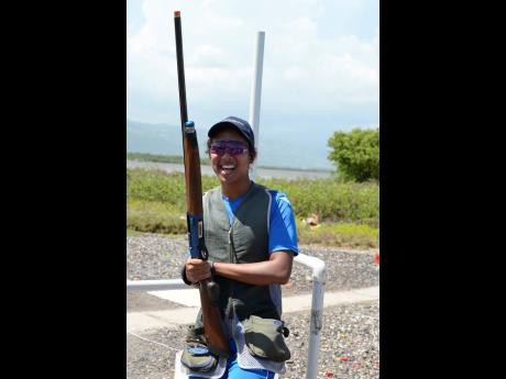 Credit: Ian Allen Cameron Phang Sang is all smiles after winning the National Commercial Bank Junior Sporting Clays Open Championship at the Jamaica Skeet Club range in Portmore, St Catherine, on Sunday.