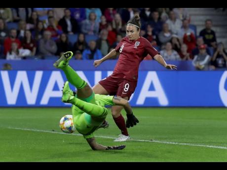 Credit: Alessandra Tarantino England’s Jodie Taylor (No. 9) beats Argentina goalkeeper Vanina Correa and scores the lone goal of the game during their FIFA Women’s World Cup Group D match at the Stade Oceane in Le Havre, France, yesterday.