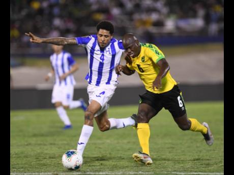 Credit: Ricardo Makyn Jamaica’s Dever Orgill (right) battles with Honduras defender Henry Figueroa for ball possession during their Concacaf Gold Cup match at the National Stadium on Monday night.