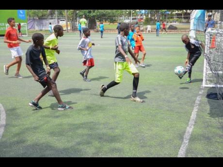 Credit: Contributed Youngsters in action at the Ballaz Liberty Park during #OurSons 2019 ‘Believe the Ball’ event on Saturday, June 15.