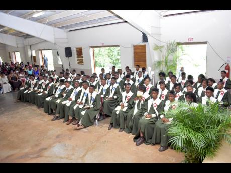 Mile Gully High’s graduating class of 2019 during their graduation ceremony at Kendal Camp in Manchester recently.  
