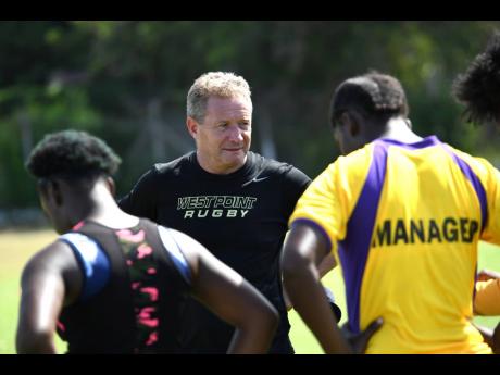 Newly appointed Jamaica Rugby Football Union coach, Stephen Lewis, shares instructions with the Jamaica Lady Crocs during a training session at Emmett Park in Kingston on Saturday morning. The Scotsman was appointed head coach of the senior men’s team, and assistant coach of their female counterparts. 
