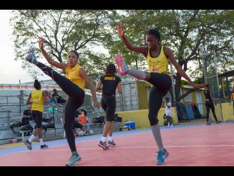 Credit: Shorn Hector Sunshine Girls Adean Thomas (left) and Nichole Dixon go through their paces during a recent training session at the Leila Robinson Courts at the National Stadium.