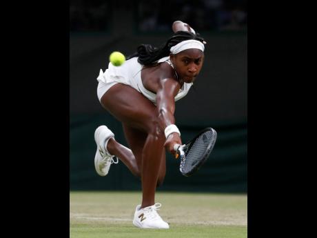 Credit: Alastair Grant United States’ Cori ‘Coco’ Gauff returns to Slovakia’s Magdalena Rybaikova in a Women’s singles match during day three of the Wimbledon Tennis Championships in London, yesterday. Gauff won 6-3, 6-3.