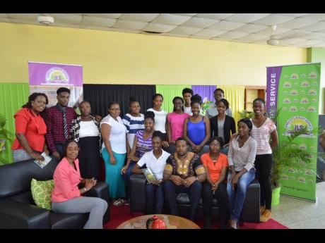 Hartley Palmer (seated, third right) with participants in the ‘Authors Live’ session, held at the Manchester Parish Library. 