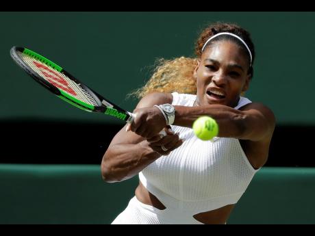 United States’ Serena Williams returns to Czech Republic’s Barbora Strycova in a women’s semi-final singles match on Day 10 of the Wimbledon Tennis Championships in London, England, yesterday. 