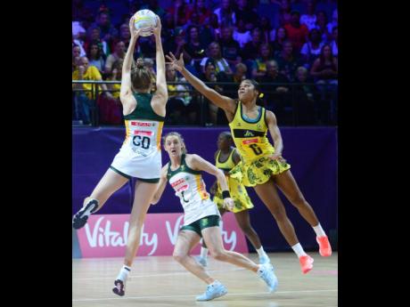 Credit: Collin Reid
Jamaica’s Adean Thomas (right) challenges for the ball as South Africa’s Karla Pretorius (GD) tries to pass it to her teammate, Erin Burger (C) during the 2019 Vitality Netball World Cup in Liverpool, England recently.