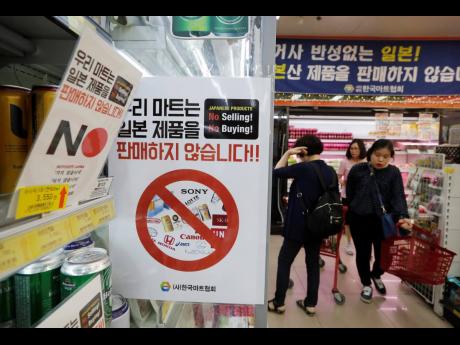 In this July 9, 2019 photo, notices campaigning for a boycott of Japanese-made products is displayed at a store in Seoul, South Korea.