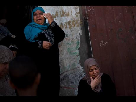 Relatives mourn the death of Hamas militant Marwan Nasser, 26, in the family house during his funeral in the town of Beit Hanoun, Northern Gaza Strip. Yesterday, Israeli troops killed Nasser, a Palestinian gunman, after he opened fire on them from across the perimeter fence around the Gaza Strip. 