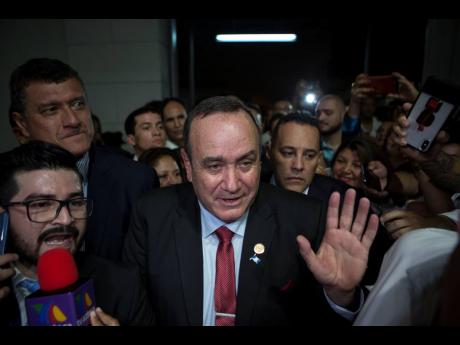 Alejandro Giammattei, presidential candidate of the Vamos party, arrives to the Electoral Supreme Court headquarters for interviews with the press after partial election results were announced in Guatemala City on Sunday.