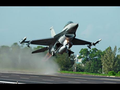 Credit: The Associated Press In this 2014 photo, a Taiwan Air Force F-16 fighter jet takes off from a closed section of highway during the annual Han Kuang military exercises in Chiayi, central Taiwan.