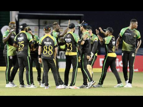 Jamaica Tallawahs players celebrate the fall of a St Lucia Stars wicket in Match 7 of the Caribbean Premier League at Sabina Park on Tuesday, August 14, 2018. 
