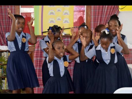 Brown’s Town Primary School students perform during celebration of the 100th anniversary of Miss Lou’s birth.