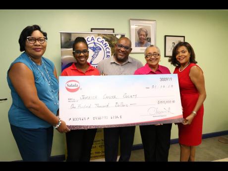 From left: Dianna Blake-Bennett, general manager at Salada Foods Jamaica and Tamii Brown, commercial and corporate affairs manager at Salada Foods Jamaica present the symbolic cheque to Michael Leslie, finance manager at JCS; Carolind Graham, president of Jamaica Reach to Recovery; and Yulit Gordon, executive director at JCS.