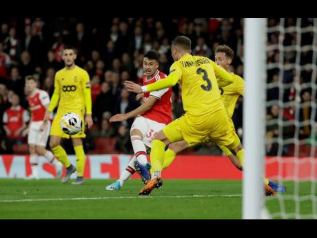 Arsenal’s Gabriel Martinelli (second left) scores his side’s second goal during their Europa League Group F match against Standard Liege at the Emirates Stadium in London yesterday.