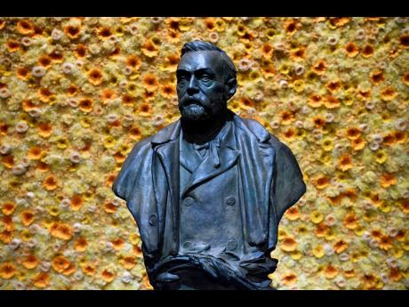 In this Monday, Dec.ember 10, 2018 file photo, a bust of the Nobel Prize founder, Alfred Nobel on display at the Concert Hall during the Nobel Prize award ceremony in Stockholm. 