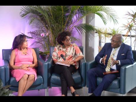 Credit: Contributed Dr Damian Ffriend (right), senior manager, JN Life Insurance Company, addresses a recent think tank session, organised by The Jamaica National Group as part of its ‘Power of Pink’ campaign in observance of Breast Cancer Awareness Month. Also pictured (from left) are: Yulit Gordon, executive director of the Jamaica Cancer Society, and Senator Dr Saphire Longmore, consultant psychiatrist and cancer survivor.
