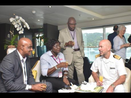 From left: Professor Fritz Pinnock; Sharon Williams, cruise liaison officer, Jamaica Tourist Board; Evroy Johnson of Lannaman & Morris Shipping; and Captain Hammish Elliott enjoying champagne aboard the ‘Seabourn Sojourn’.