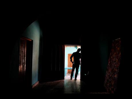 In this Aug. 23, 2019, photo, a Honduran father stands at his home in Comayagua, Honduras, after talking in an interview about being separated from his 3-year-old daughter at the border after traveling for weeks to seek asylum in the U.S. According to court records, his daughter was sexually abused in U.S. foster care. She was later deported and arrived back in Honduras withdrawn, anxious and angry. He fears their bond is forever broken. (AP Photo/Elmer Martinez)