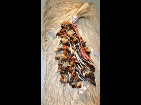 Laura Facey’s ‘Spirit Dancer’ 1998 – fired clay, feathers, fabric and straw. 