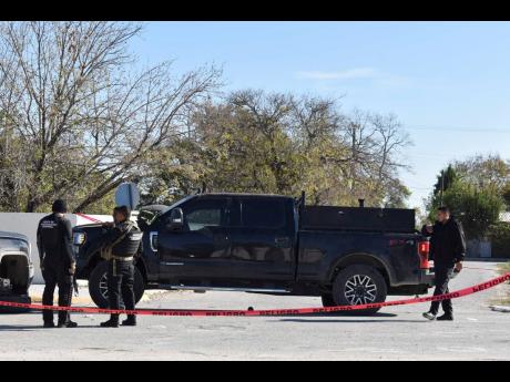 Police block a road in VIlla Union, Mexico, on Sunday, December 1, the day after it was assaulted by gunmen. 
