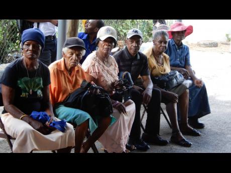 Vendors turn out for a meeting with municipal authorities to discuss post-fire rehabilitation of the May Pen Market. The shopping venue is expected to temporarily reopen on December 13. 