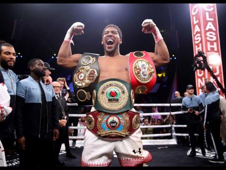 Credit: Nick Potts
Britain’s Anthony Joshua celebrates after beating Andy Ruiz Jr. on points to win their World Heavyweight Championship contest at the Diriyah Arena, Riyadh, Saudi Arabia, yesterday.