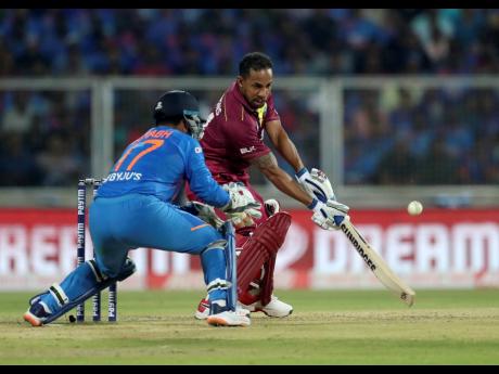 Credit: Aijaz Rahi Windies’ Lendl Simmons (right) plays a shot on his way to his first half-century in nearly four years during the second Twenty20 International cricket match against India in Thiruvanathapuram, India, yesterday.