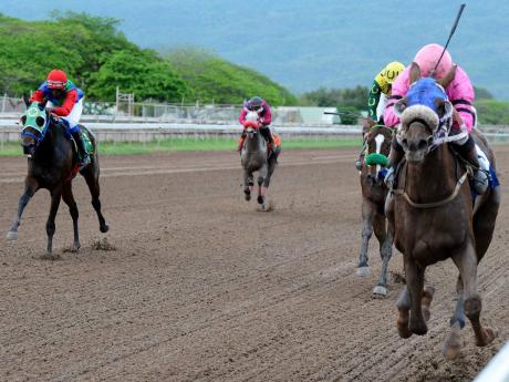 SENTIENT (right), ridden by Dane Nelson, winning the seventh race at Caymanas Park on Saturday, March 30, 2019.