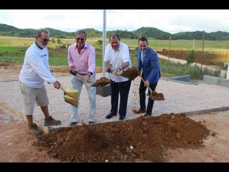 Agriculture Minister Audley Shaw (second right) participates in the groundbreaking for Organic Growth Holdings Incorporated’s (OGH) medicinal hemp farm at Swanswick in Trelawny. From left are Mitchel Yeckes, managing director of OGH; Robert Weinstein, co-founder and president of OGH; and Shawn Rogers, vice-president, OGH. 
