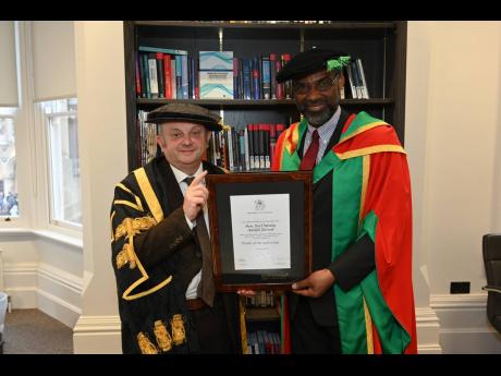 Credit: Contributed Earl Jarrett (right) with Nottingham Trent University Vice Chancellor Edward Peck after being conferred with the honour, Doctor of the University.