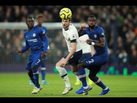 Credit: (AP Photo/Ian Walton) Tottenham’s Harry Kane (centre) and Chelsea’s Antonio Rüdiger (right) chase after the ball during their English Premier League match at the Tottenham Hotspur Stadium in London, England, yesterday.