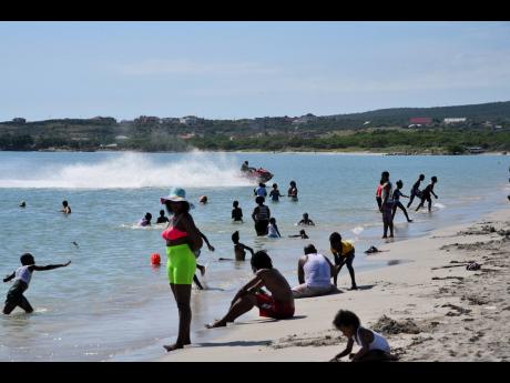 On a day when the Hellshire Beach in St Catherine would normally be abuzz with activities as hundreds of beachgoers converge on the area, business operators yesterday (Boxing Day) say many persons have stayed away because they are fearful they could become victims of crocodile attacks. 