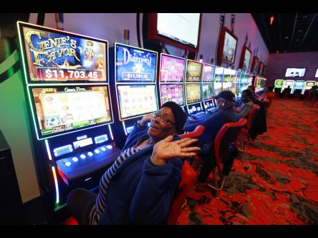 AP
Shelia Hargrove of Richmond, Virginia, United States plays gaming machines at Rosie’s gaming centre. 