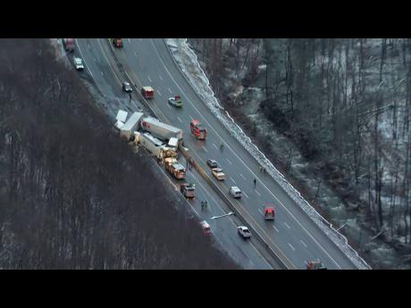 This image from video provided by KDKA TV shows the scene near Greensburg, along the Pennsylvania Turnpike, where at least five people were killed and dozens were injured in a crash early yesterday that involved multiple vehicles, a transportation official said.