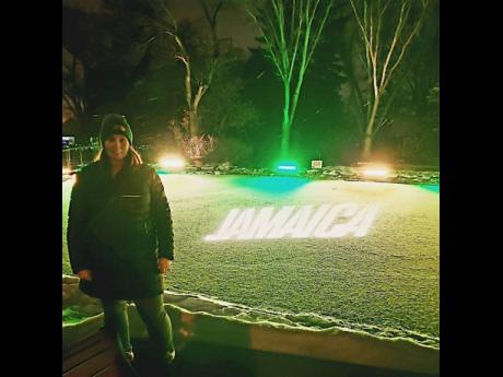 Emma Madsen, JTB business development manager – Western Canada, poses in front of the Jamaica-branded ice rink at the 2019 Zoominescence Light Festival in Edmonton, Alberta. 