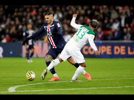 Credit: AP PSG’s Mauro Icardi (left) vies for the ball with Saint Etienne’s Miguel Trauco during the French League Cup quarter-final match at the Parc des Princes stadium in Paris on Wednesday.