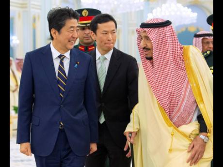 Credit: The Associated Press Saudi King Salman (right), receives Japan's Prime Minister Shinzo Abe in Riyadh, Saudi Arabia yesterday. (AP)